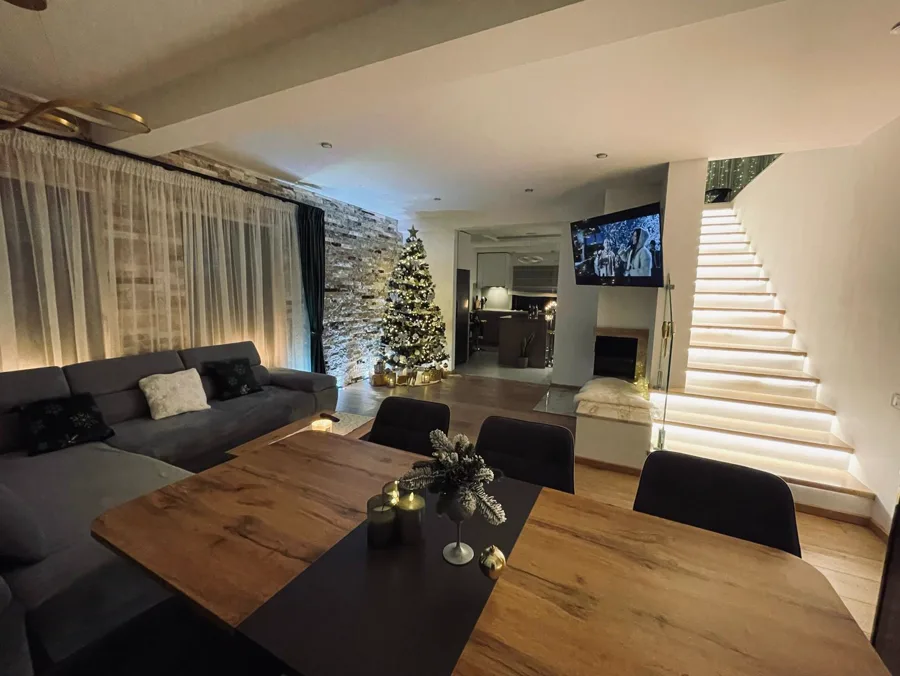 Living room with grey sofa and TV — relaxation area